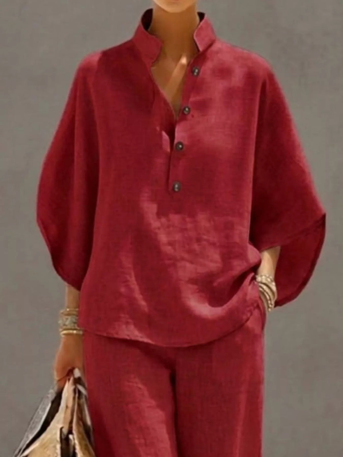 Plus size women's two-piece set with button-detail 3/4 sleeve top and pants, stylish dress from Plush Fashion Hub.