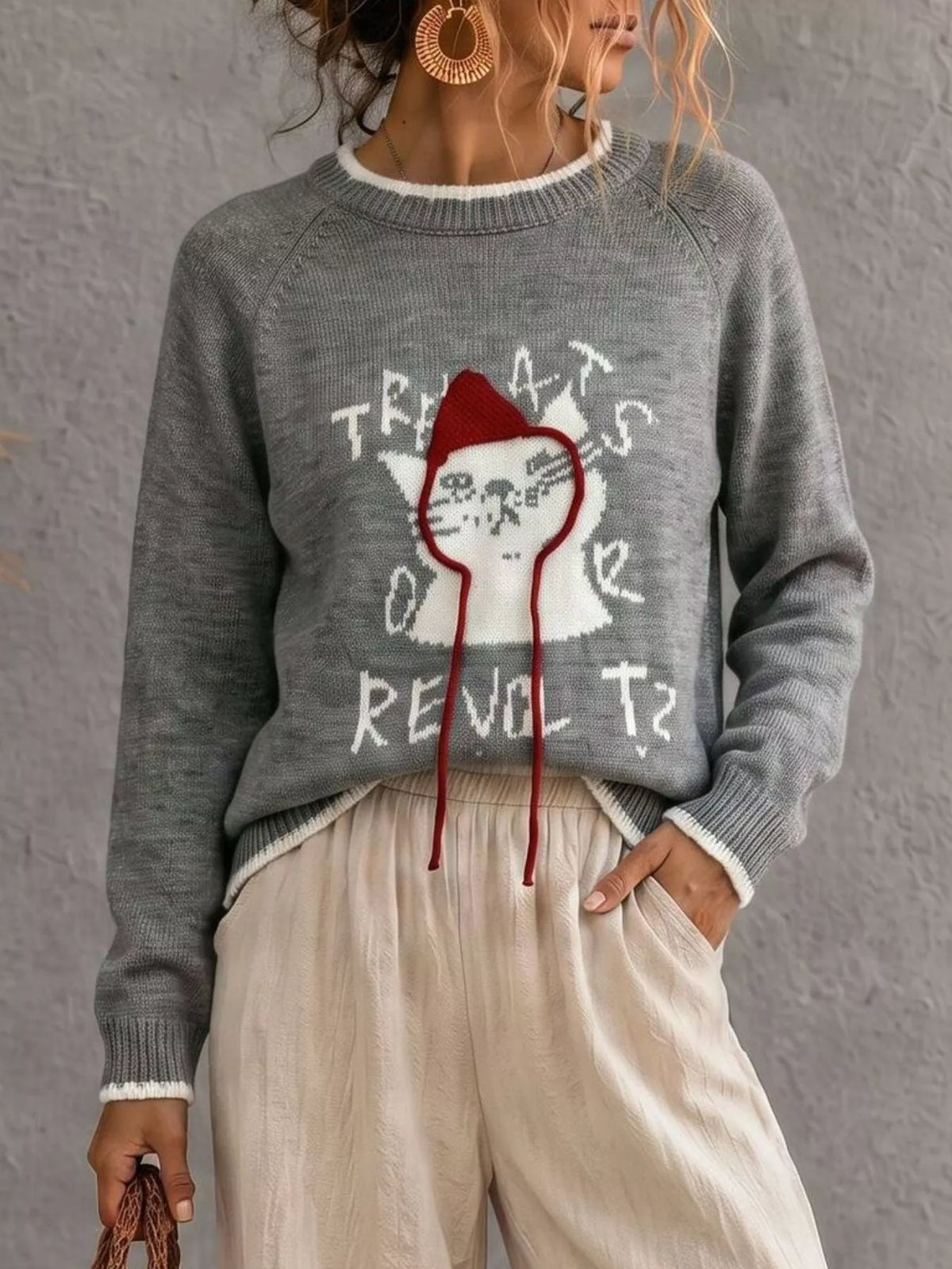 Trendsi cat raglan sleeve sweater featuring a soft knit fabric, casual fit, and stylish design for comfortable everyday wear.