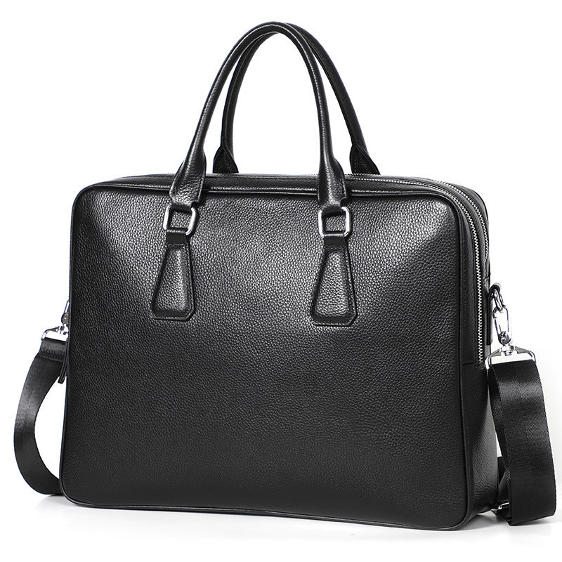 Men's Pi-Mart leather briefcase made of cowhide, horizontal large capacity handbag with sturdy handles and sleek design.