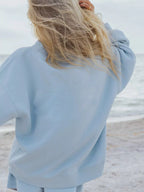 Trendsi relaxed fit round neck sweatshirt and shorts set, casual 2-piece loungewear in soft fabric, displayed on a hanger.