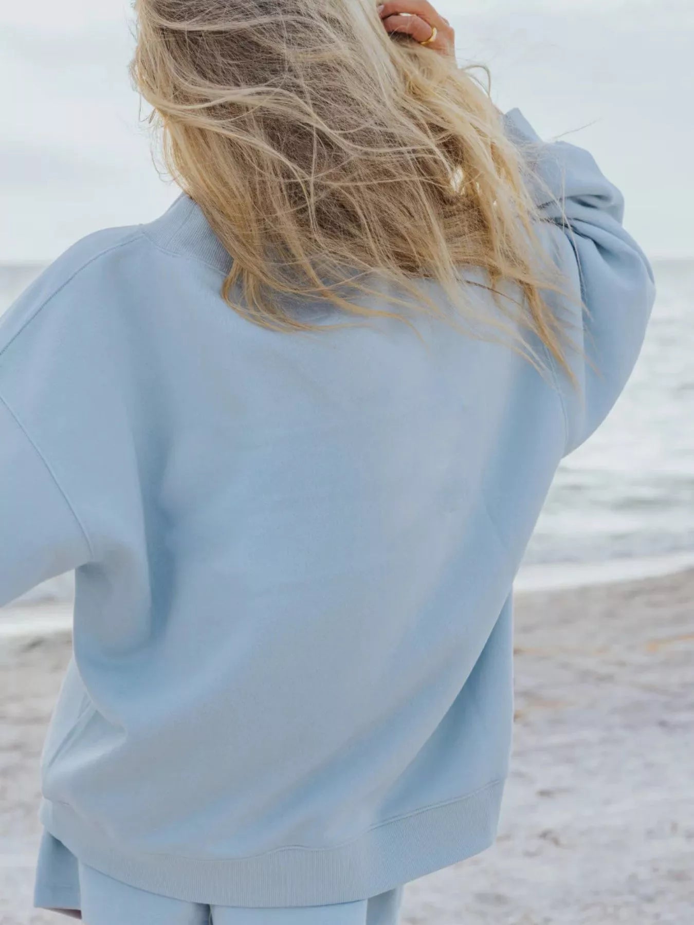 Trendsi relaxed fit round neck sweatshirt and shorts set, casual 2-piece loungewear in soft fabric, displayed on a hanger.