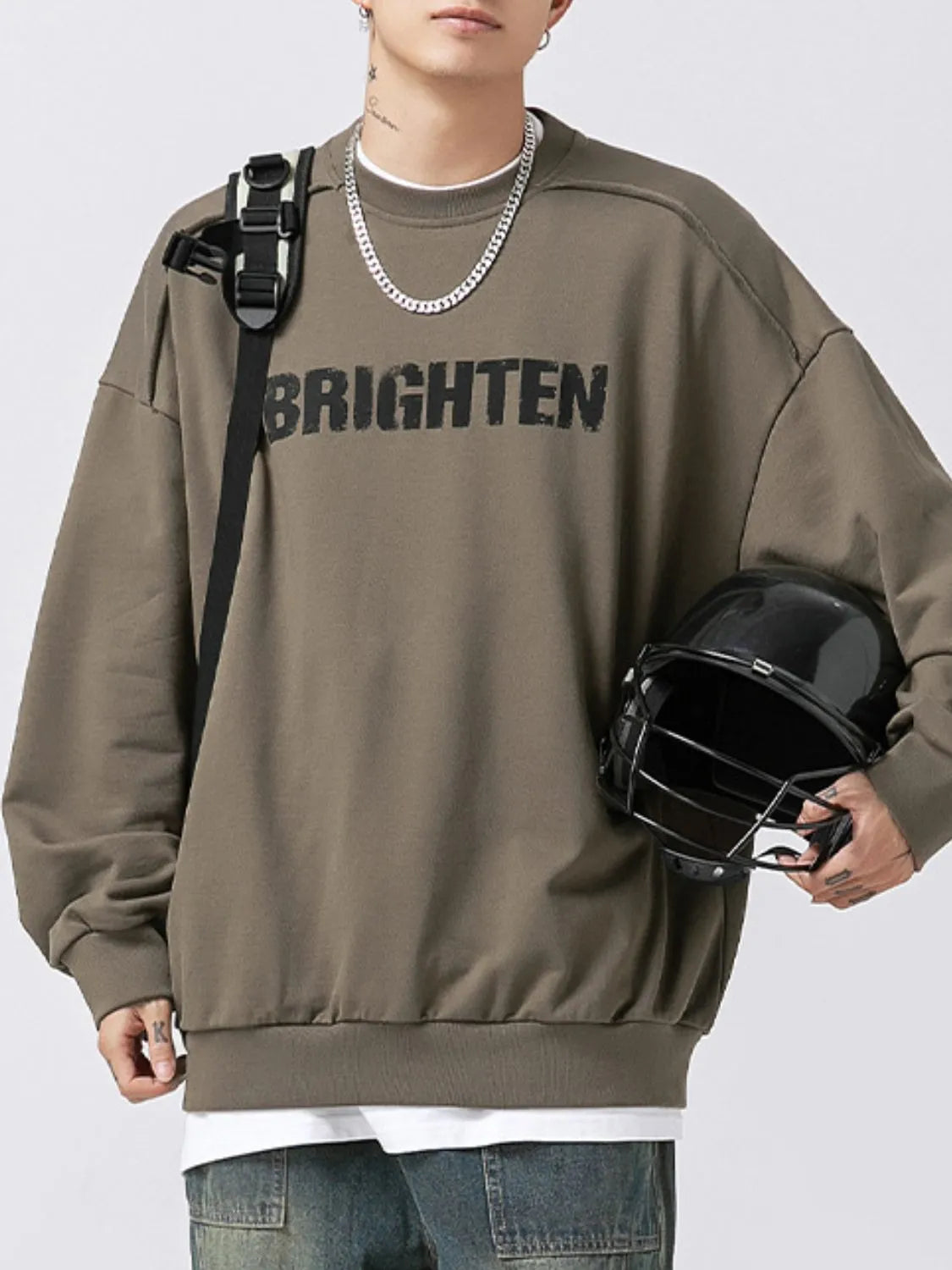 Men's long sleeve sweatshirt with letter graphic design, round neck style by Trendsi, casual men's fashion top.