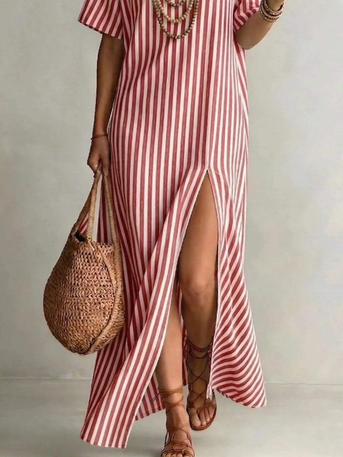 Plus size striped maxi dress with side slit, featuring full-figure fit and trendy design from Trendsi.