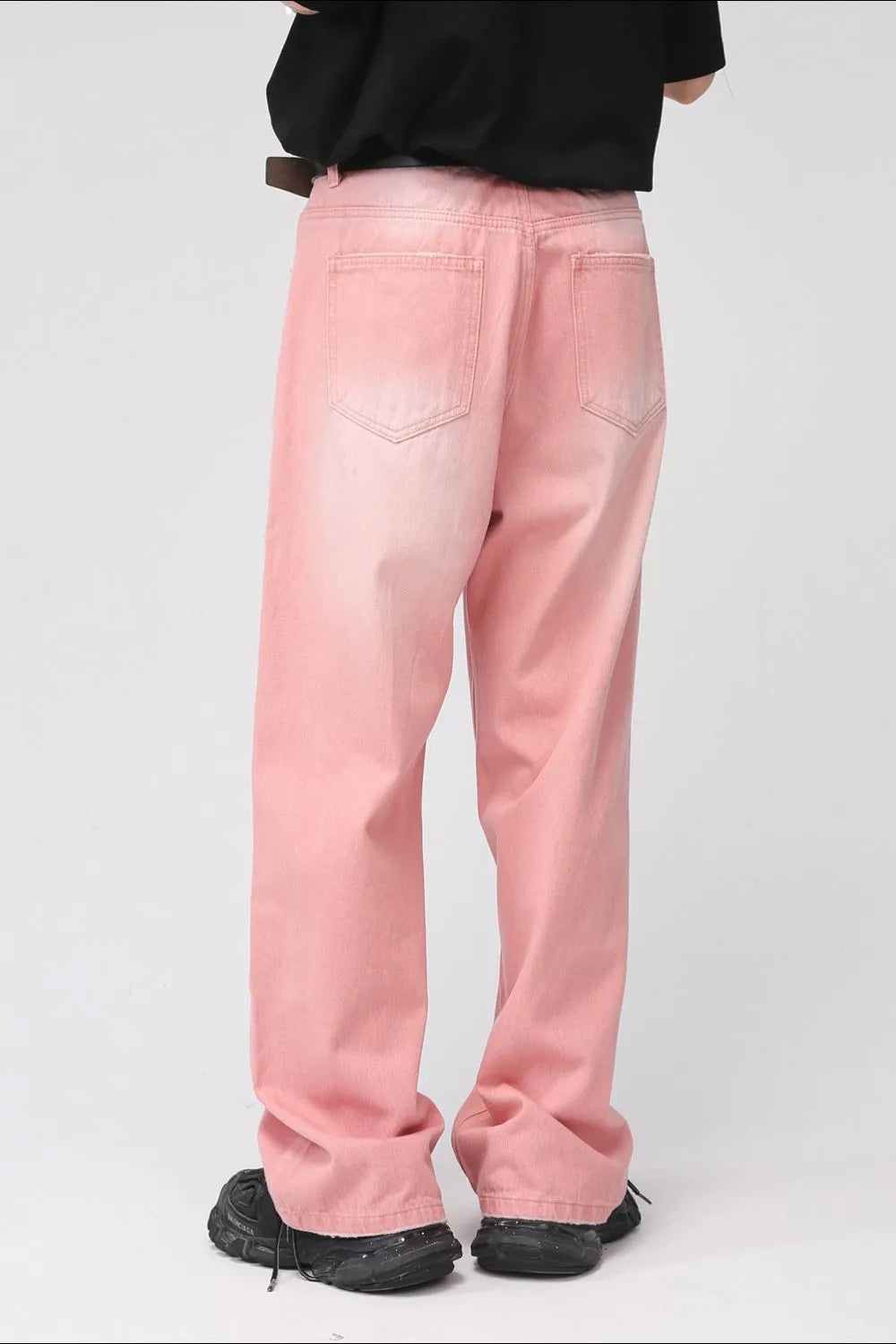 Plush Fashion Hub pocketed baggy denim jeans with a relaxed fit and faded blue wash, displayed on a hanger.