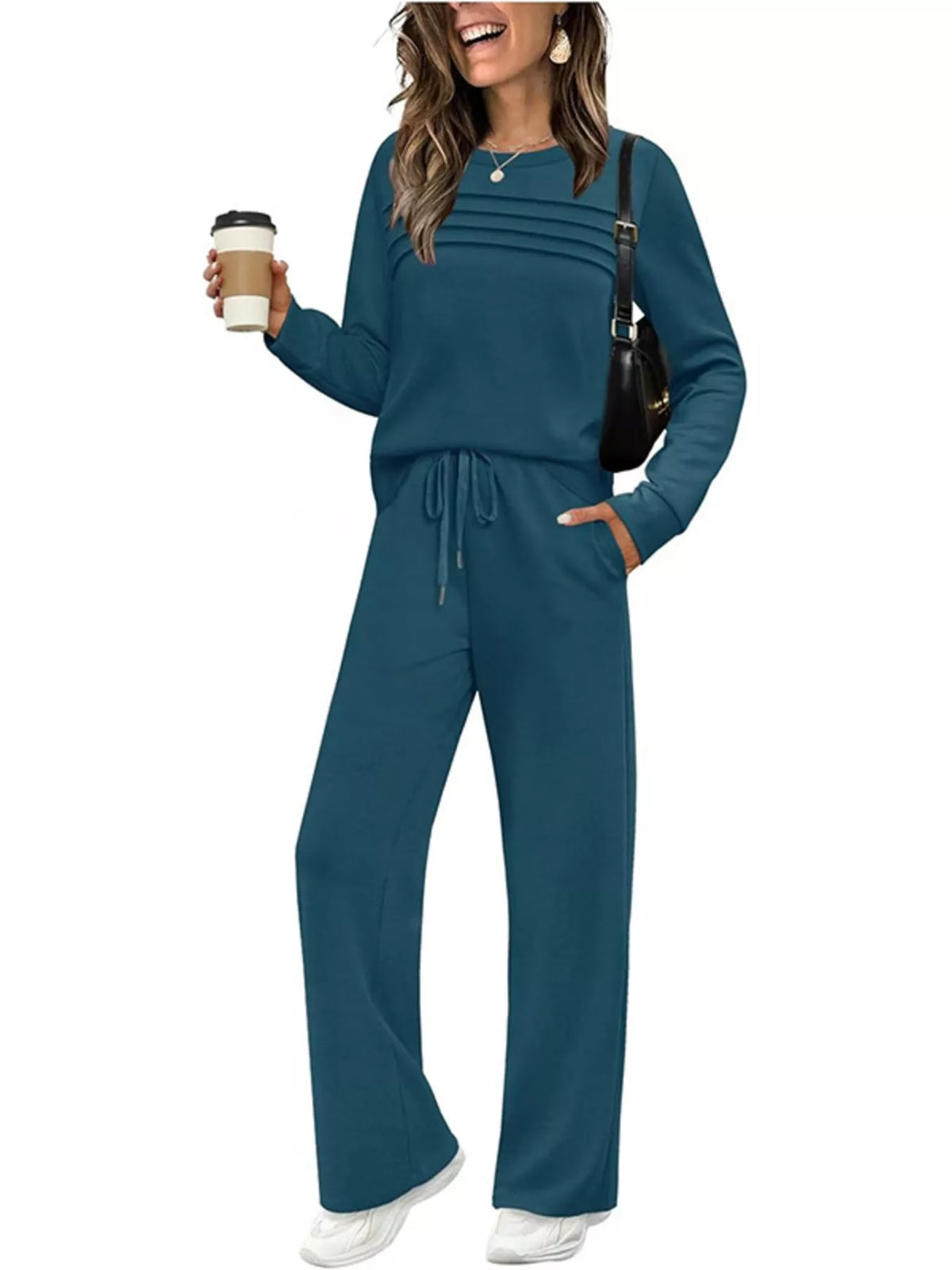 Plus size casual long sleeve crewneck top and drawstring pants matching set by Trendsi, featuring comfortable fabric and relaxed fit.