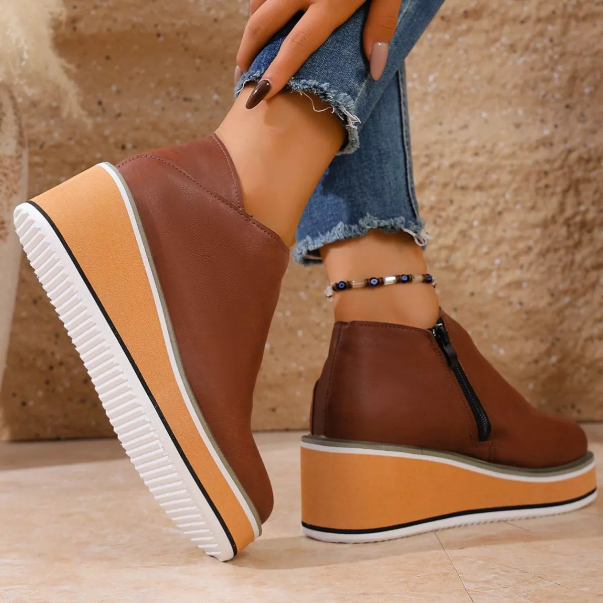 Women's round toe wedge ankle boots by Trendsi, showcasing stylish leather upper and chunky heel for a modern look.