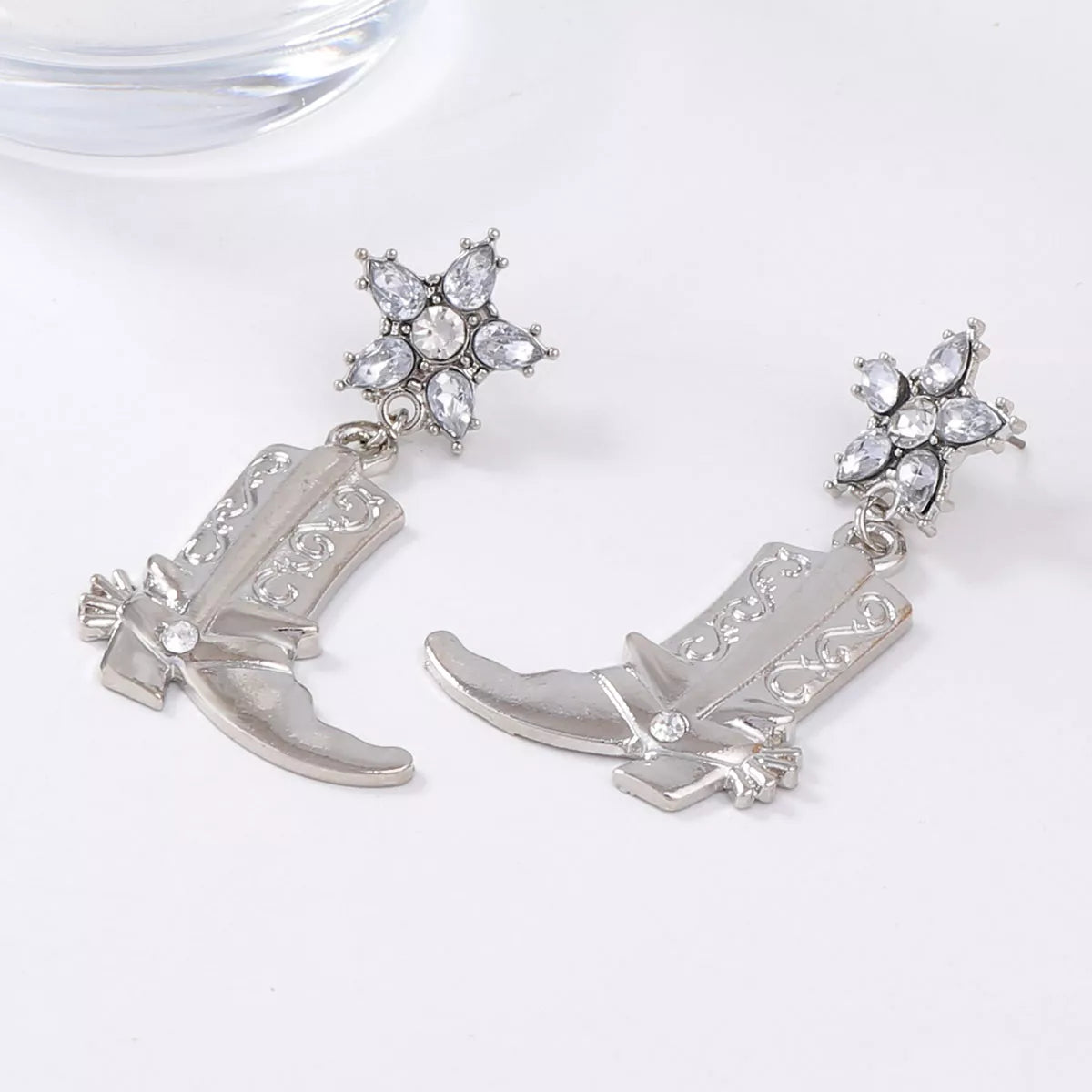 Western style dangle earrings by Plush Fashion Hub featuring boot-shaped charms and intricate metal detailing.