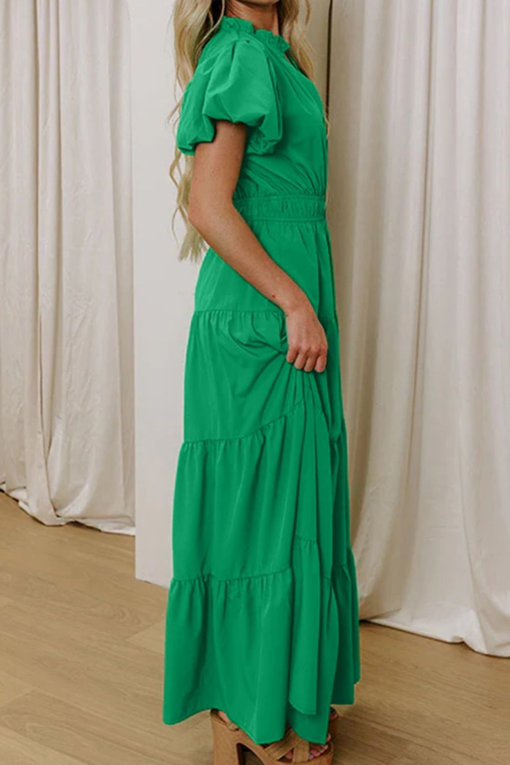 Women's floral maxi dress with ruffled tiers and puff sleeves, elegant long dress by Trendsi featuring a flowing silhouette.