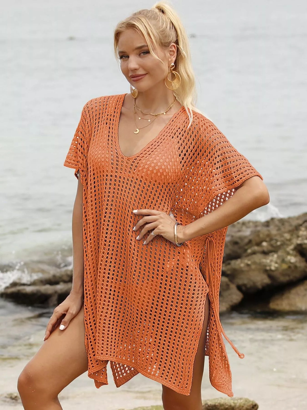 Openwork V-neck slit cover-up by Plush Fashion Hub, lightweight and stylish beachwear with intricate openwork design and V-neck detail.