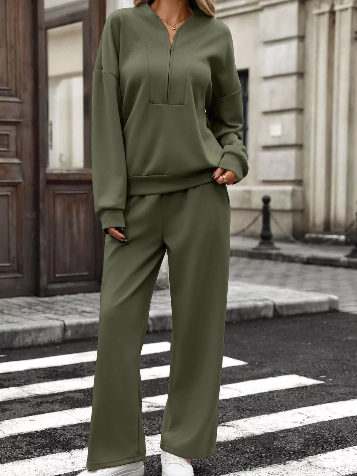 Women’s half zip sweatshirt and wide-leg pants set by Trendsi, featuring a cozy fleece fabric and casual loungewear style.