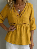 Women's V-neck hollow-out fringe cotton-linen top by FitiqueFit, featuring a casual V-neck design with fringe and hollow-out details.