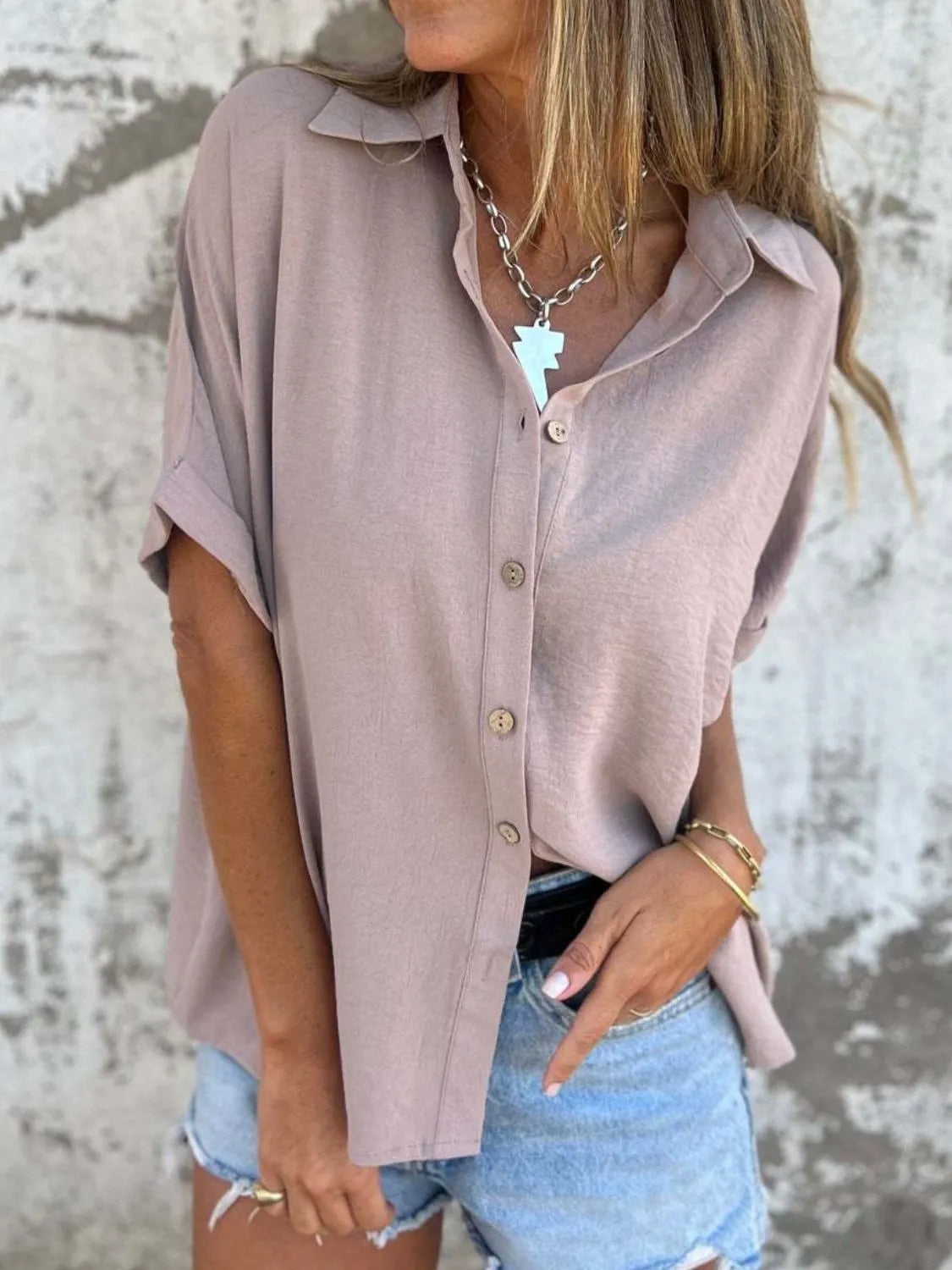 Women's half sleeve collared button-down office blouse from Plush Fashion Hub, featuring a classic tailored design and crisp fabric.