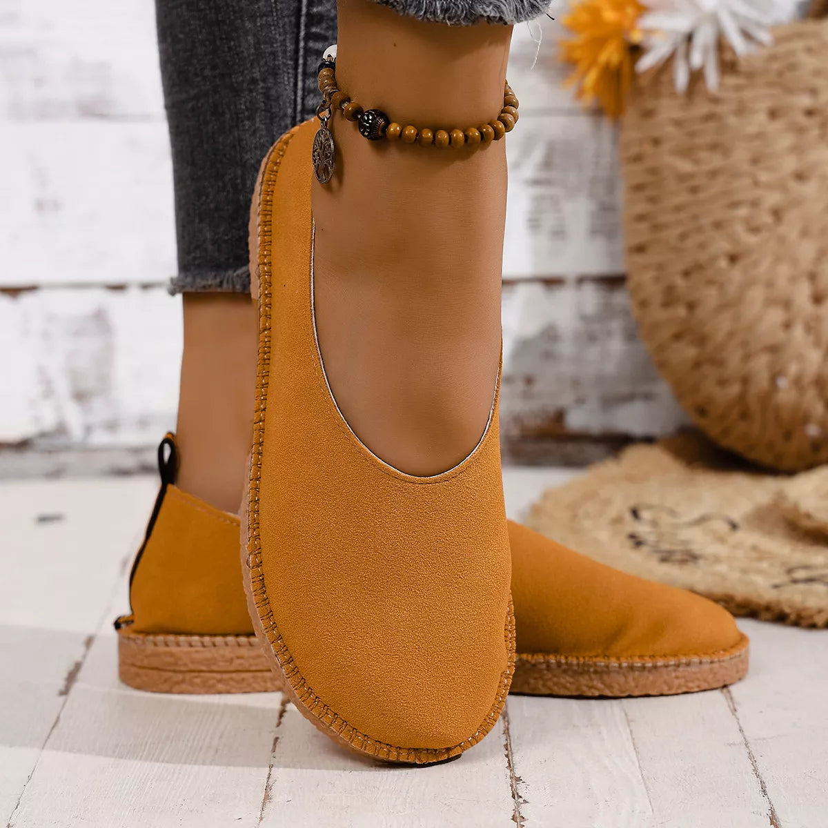 Round toe slip-on flats by Plush Fashion Hub, featuring a sleek design and comfortable fit, shown in a neutral color.
