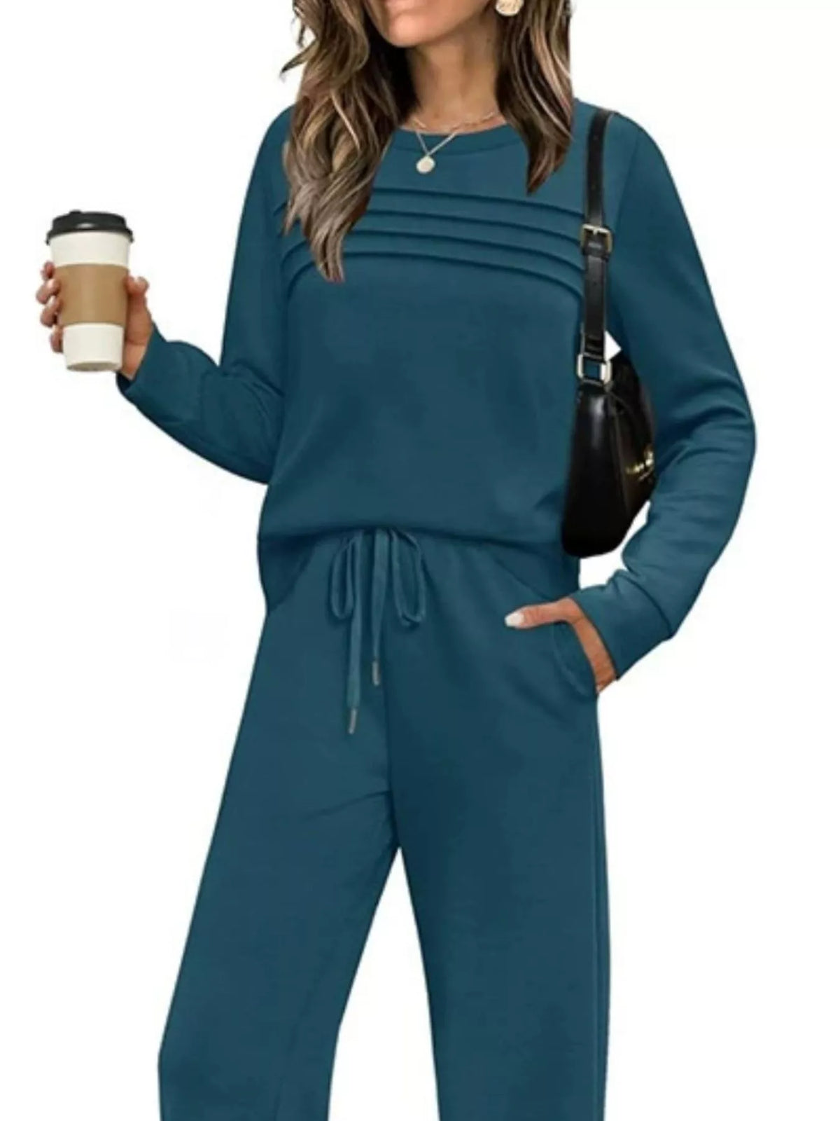 Plus size casual long sleeve crewneck top and drawstring pants matching set by Trendsi, featuring comfortable, stylish loungewear.