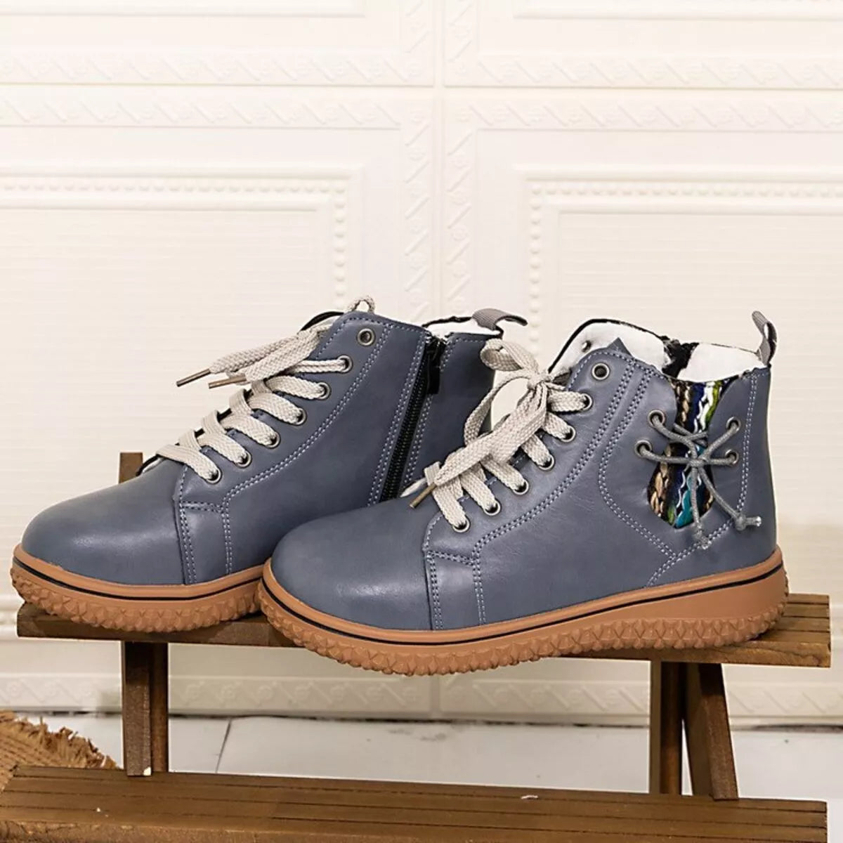 Women's round toe platform ankle boots by Trendsi featuring chunky heels and sleek black leather finish.