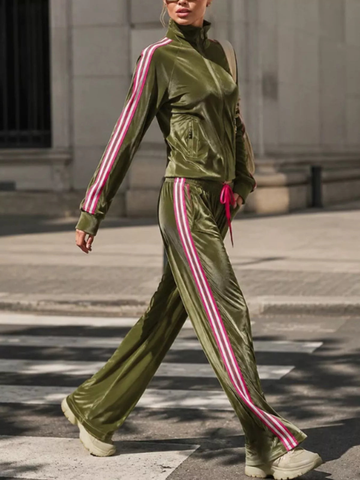 Striped zip-up outerwear and pants matching set by Trendsi, featuring a stylish design and comfortable fit.