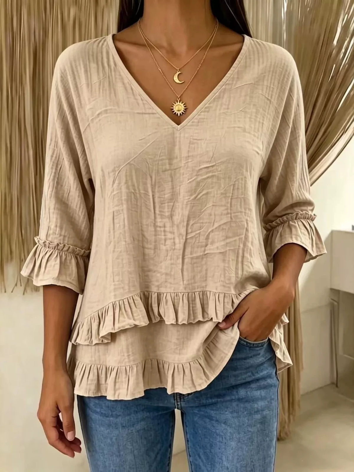 V-neck ruffle sleeve blouse from Trendsi featuring lightweight fabric, feminine ruffle details, and a stylish V-neck design.