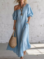 One-shoulder puff sleeve maxi dress by Trendsi featuring flowing fabric and elegant design, perfect for dressy occasions.
