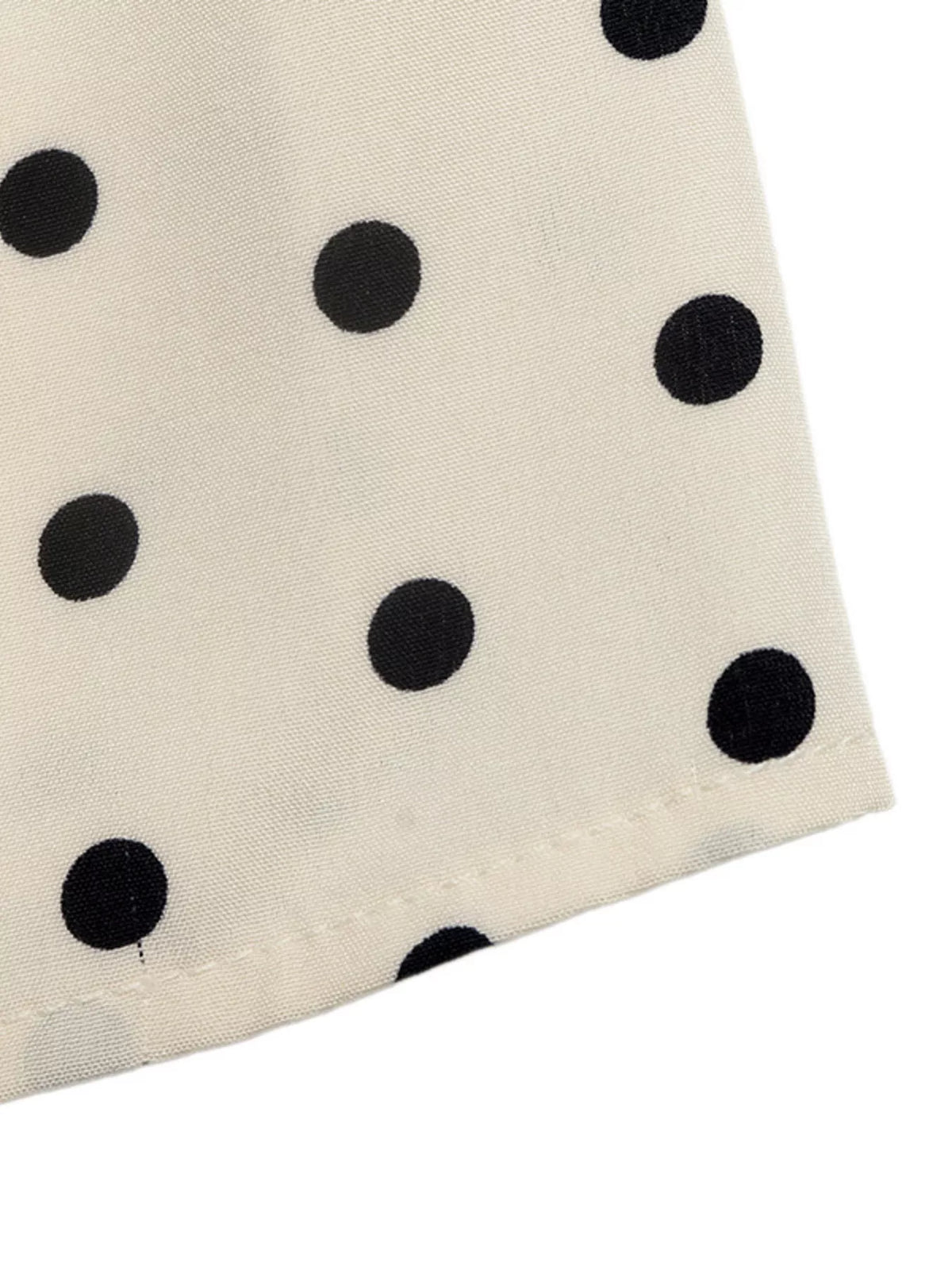 Polka dot halter neck mini dress by Plush Fashion Hub featuring a fitted silhouette and playful polka dot pattern.