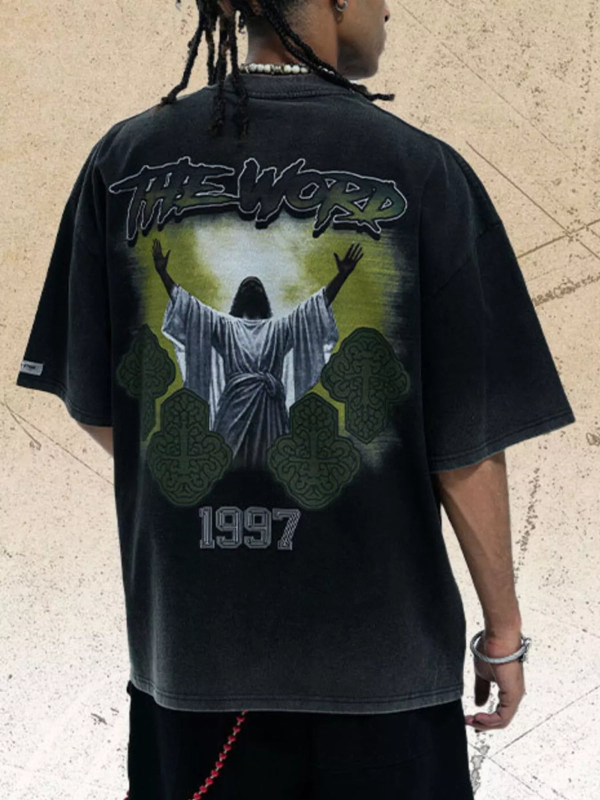 Men's graphic round neck short sleeve T-shirt from Trendsi, showcasing a vibrant design on soft fabric.