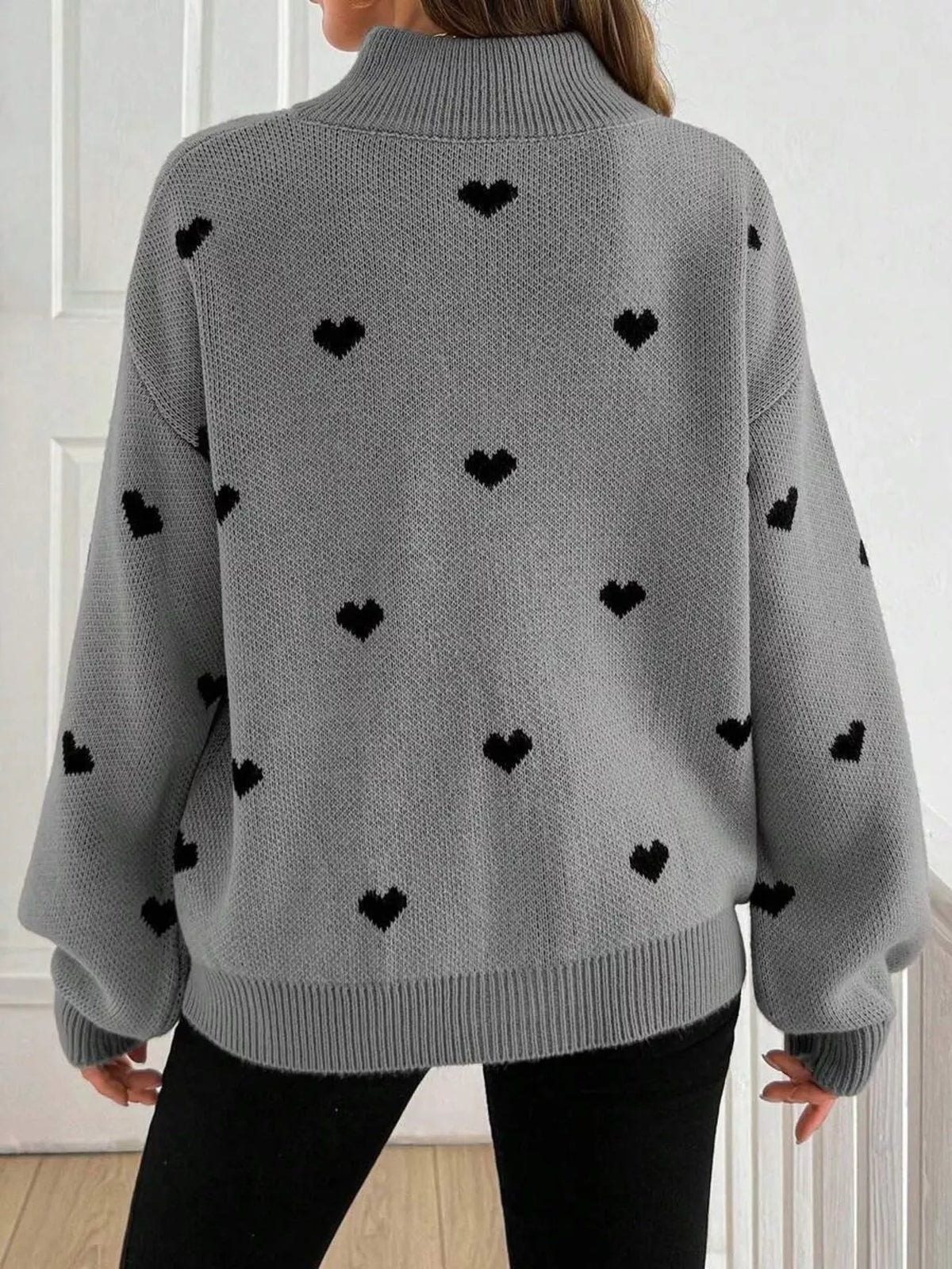 Plus size full heart half-zip long sleeve sweater by Trendsi, featuring a stylish heart design and comfortable fit.