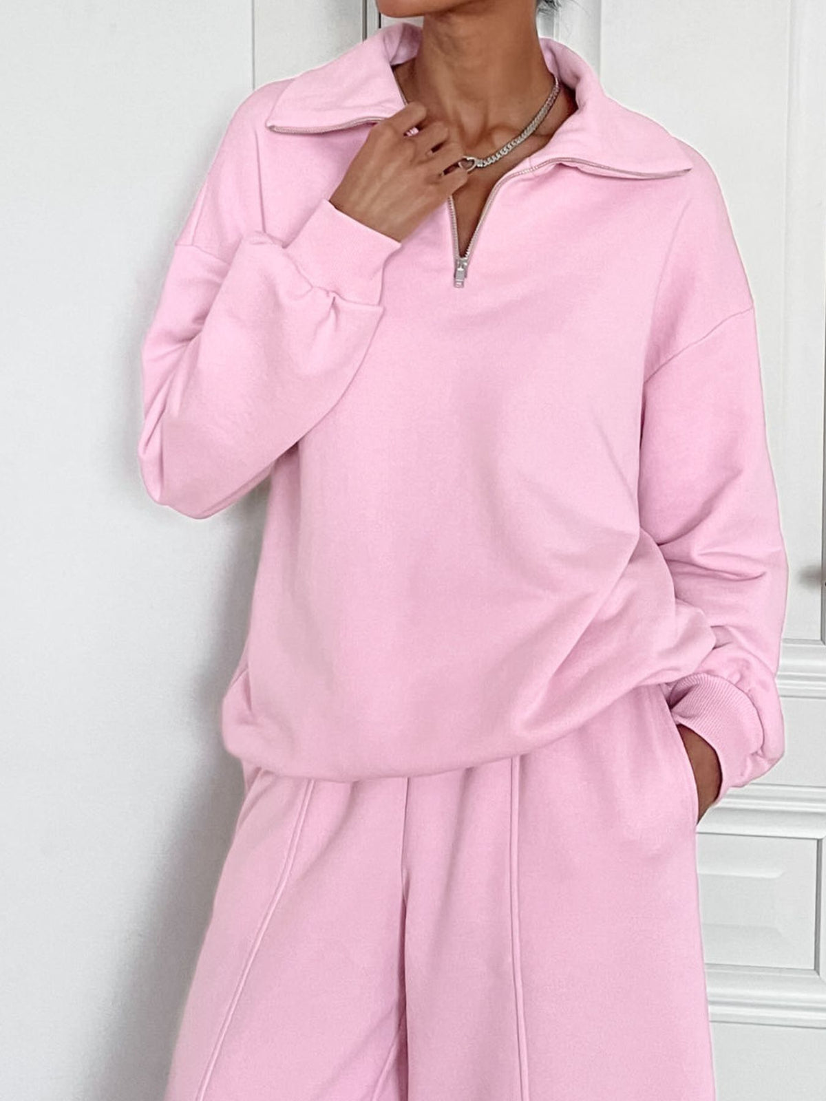 Plush Fashion Hub women's quarter zip long sleeve loungewear set, two-piece tracksuit in soft fabric, shown on a hanger.