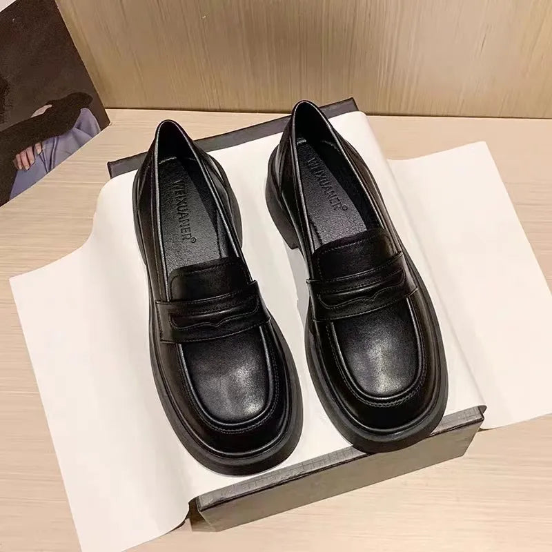 Women's round toe platform loafers by Trendsi, stylish and comfortable shoes with a chunky heel and classic design.