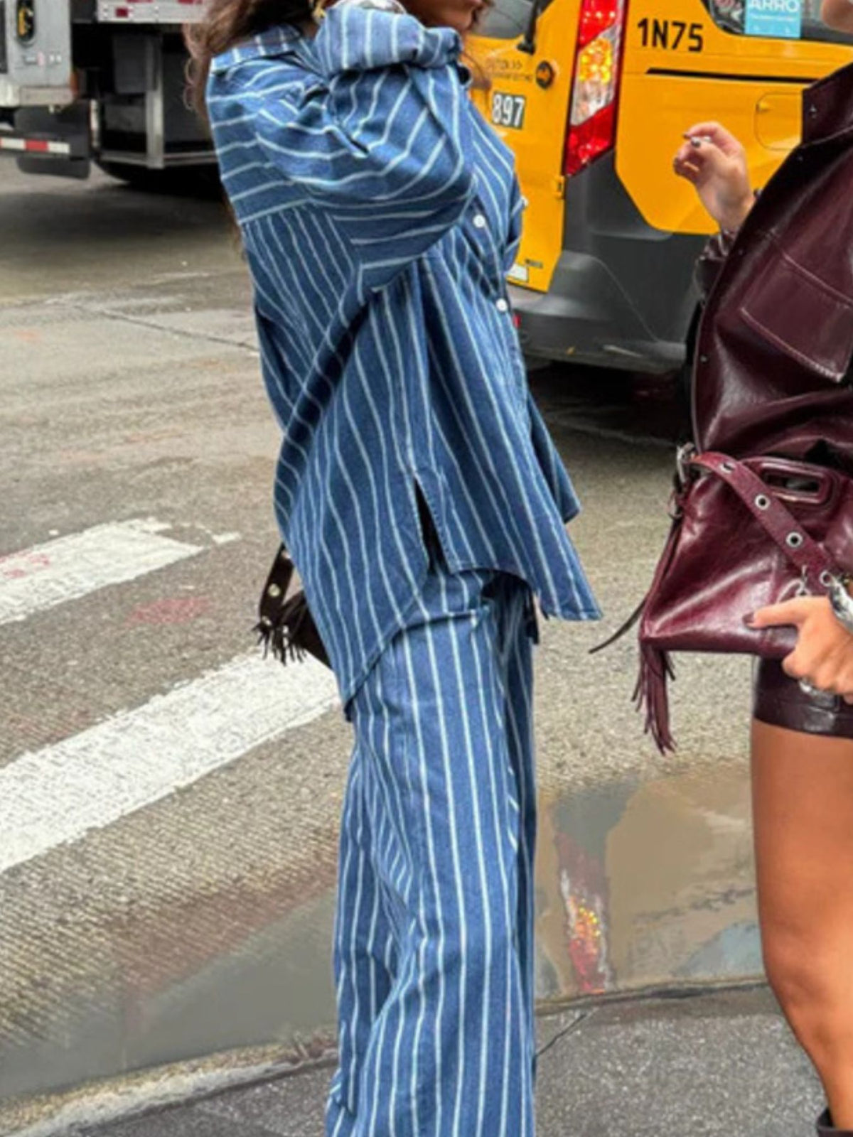 Womens striped button-up shirt and wide-leg pants two-piece set by Plush Fashion Hub, featuring a stylish coordinated outfit.