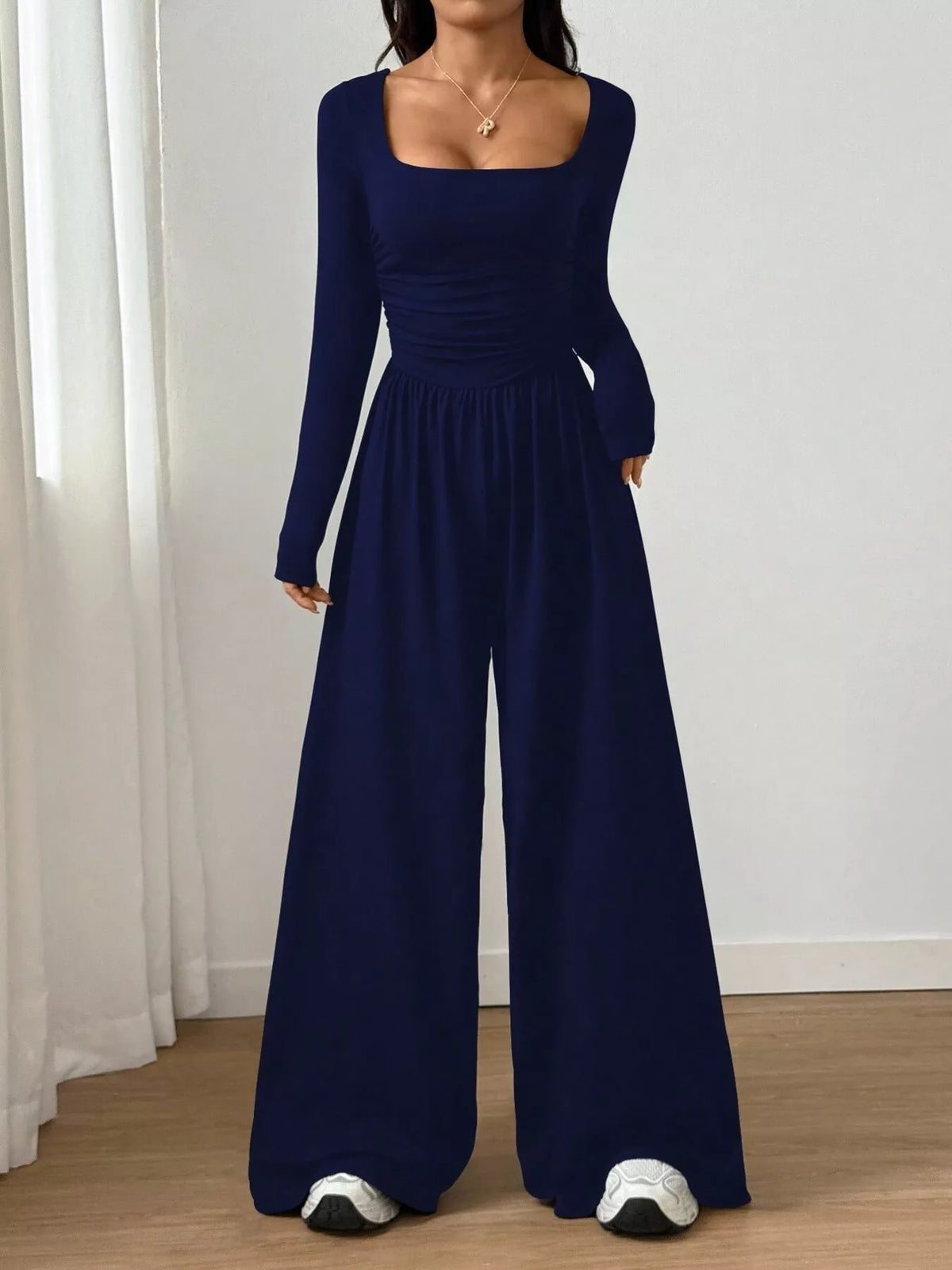 Ruched square neck wide-leg jumpsuit by Trendsi featuring a stylish design and comfortable fit, shown in the image.