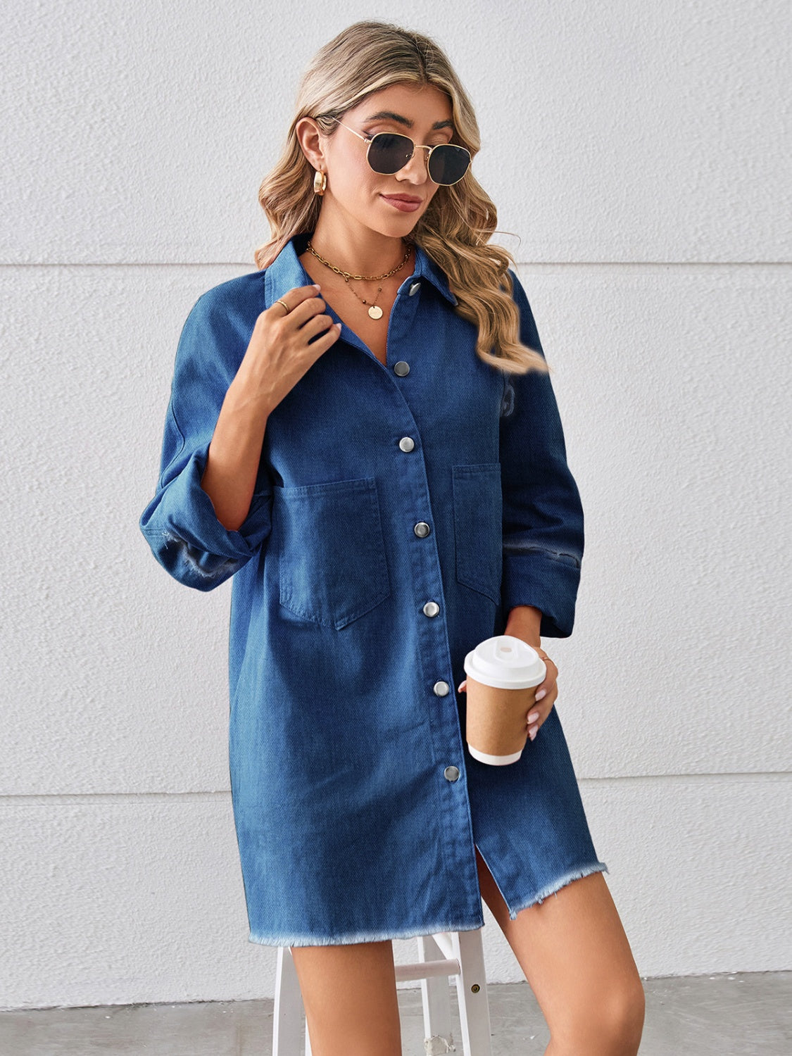 Raw hem button-up denim dress by Plush Fashion Hub, featuring a classic fit with distressed raw hem and front button closure.