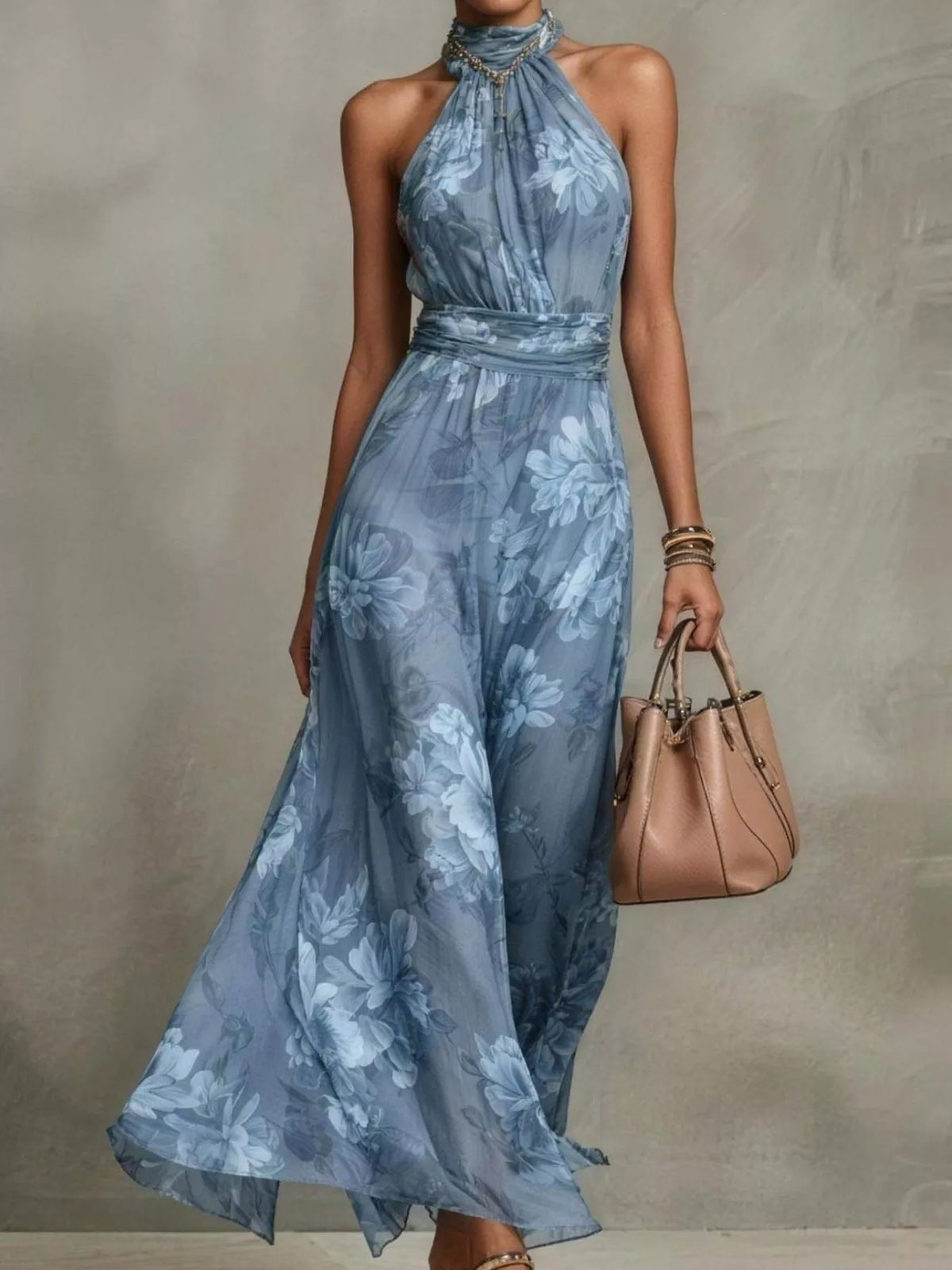 Plus size floral print sleeveless maxi dress by Trendsi, featuring a full-length design with vibrant floral patterns.
