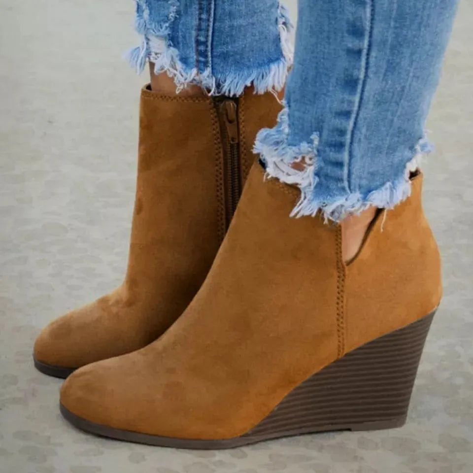Black high heel ankle boots with side zipper and sleek design, trendy footwear by Trendsi.