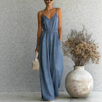 Women's sleeveless wide-leg jumpsuit by FitiqueFit in multiple colors, showing front view with adjustable straps and flowy fabric.
