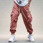 Men's streetwear cargo pants with multiple pockets and drawstring waist by FitiqueFit, shown in a casual urban outfit.