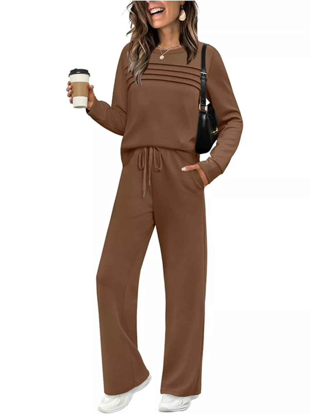 Plus size casual long sleeve crewneck top with matching drawstring pants set by Trendsi, featuring comfortable fabric and relaxed fit.