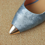 Pointed-toe stiletto heel in metallic blue distressed leather with a shiny gold-tone metal cap toe.