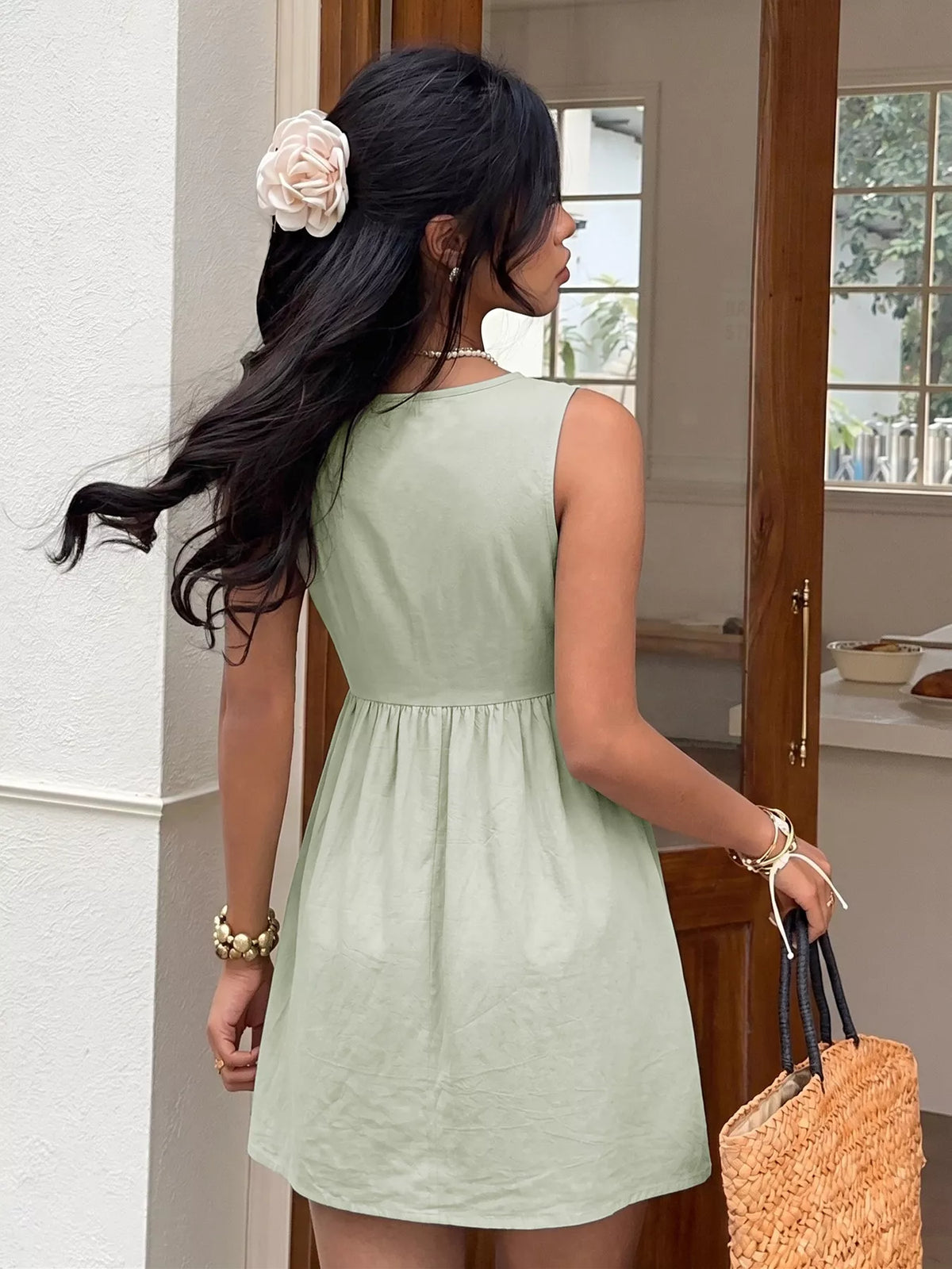 Sleeveless button-front A-line dress by Plush Fashion Hub, featuring a stylish silhouette and classic design, shown in the image.