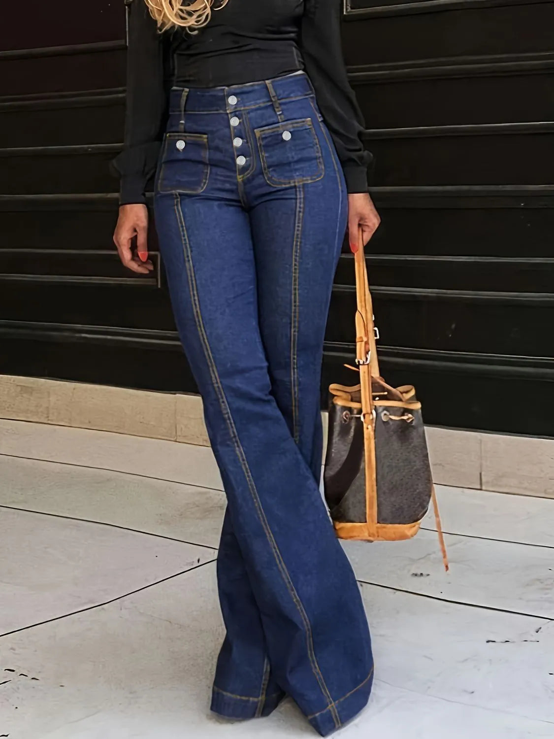 Plush Fashion Hub denim flare jeans with front and back pockets, showcasing a stylish fit and classic blue denim fabric.
