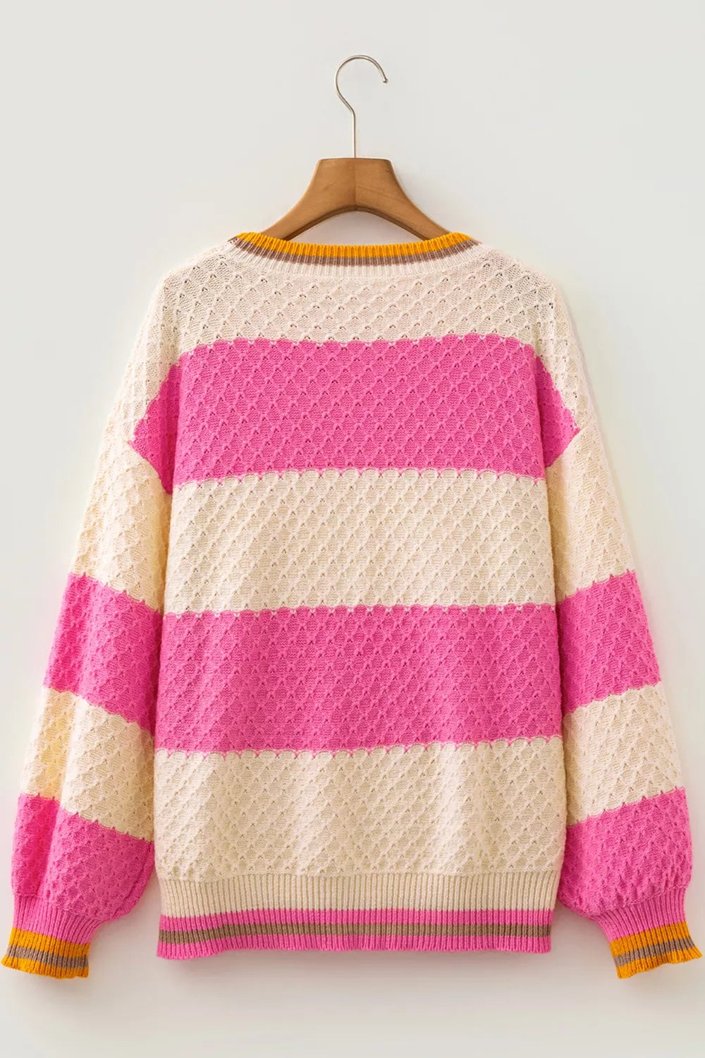 Women's striped colorblock textured drop shoulder sweater by Trendsi, featuring bold stripes and cozy knit fabric.