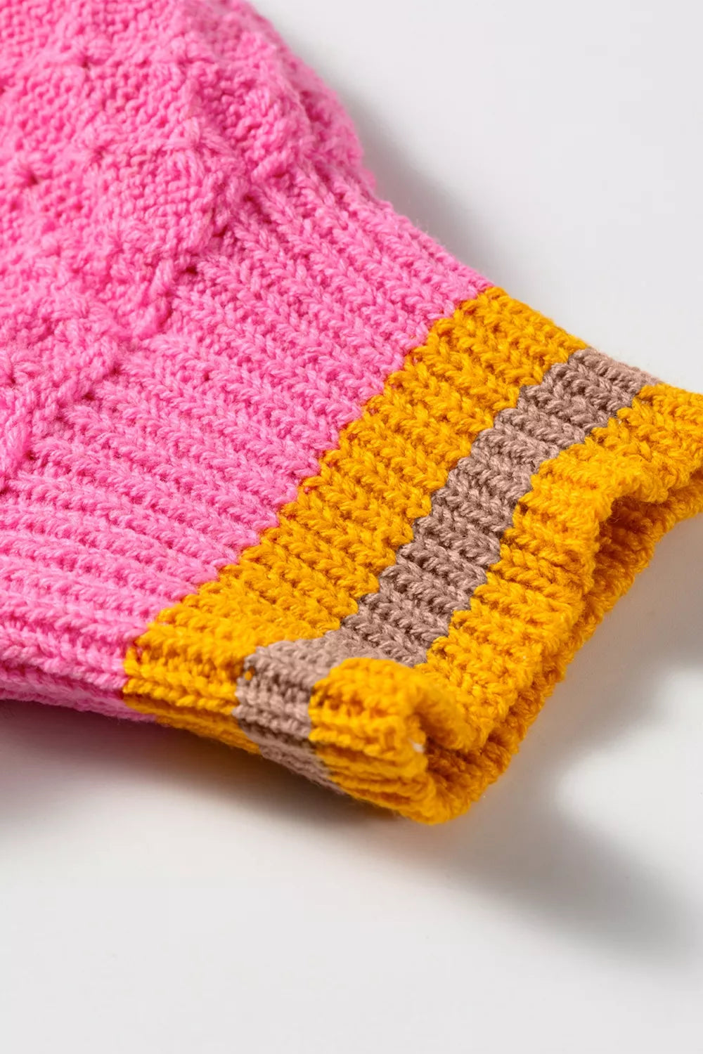 Women's striped colorblock textured drop shoulder sweater by Trendsi, featuring a cozy knit with bold color contrasts.
