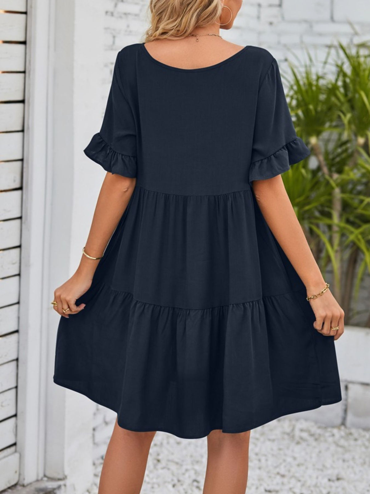 Lightweight rayon mini dress by Plush Fashion Hub with ruffled sleeves, tiered design, and pockets, perfect for casual summer wear.