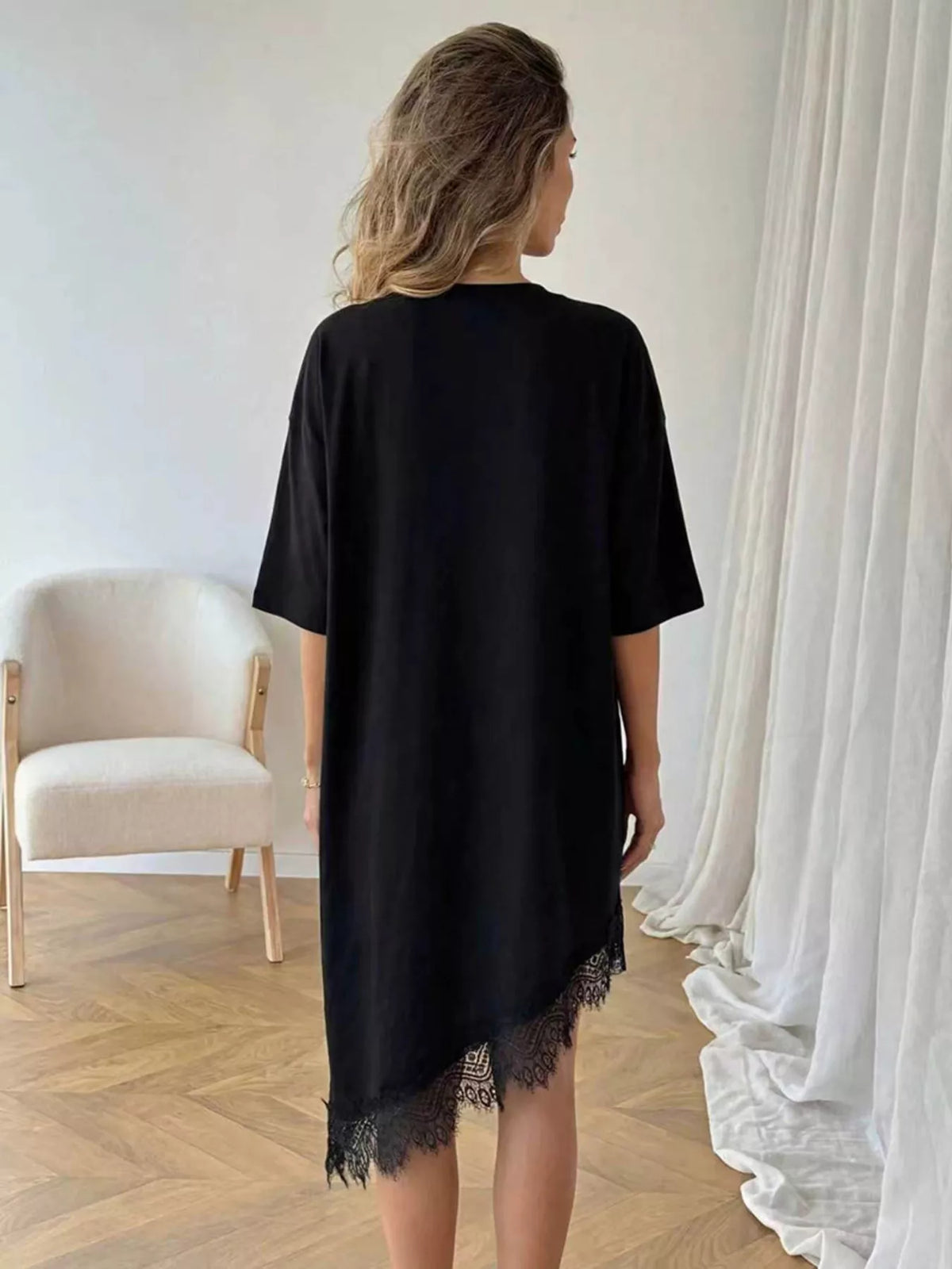 Lace trim asymmetrical hem T-shirt dress by Plush Fashion Hub, featuring a casual shirt dress with lace accents and uneven hem detail.