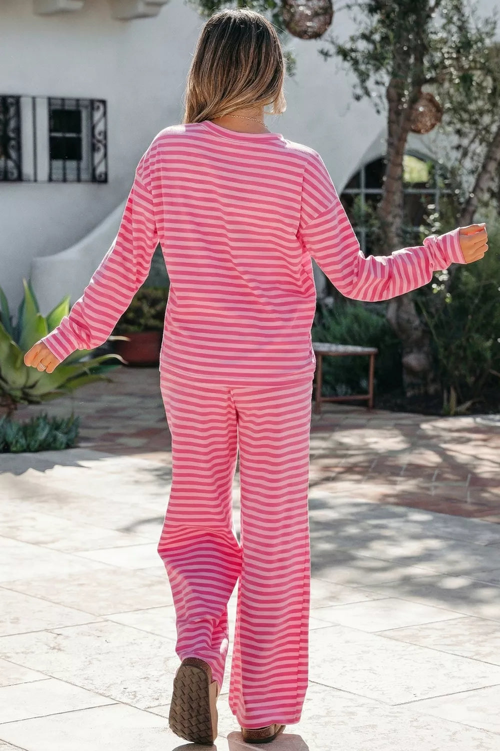 Striped drop shoulder round neck top with buttoned straight pants set by Plush Fashion Hub, shown on a model.