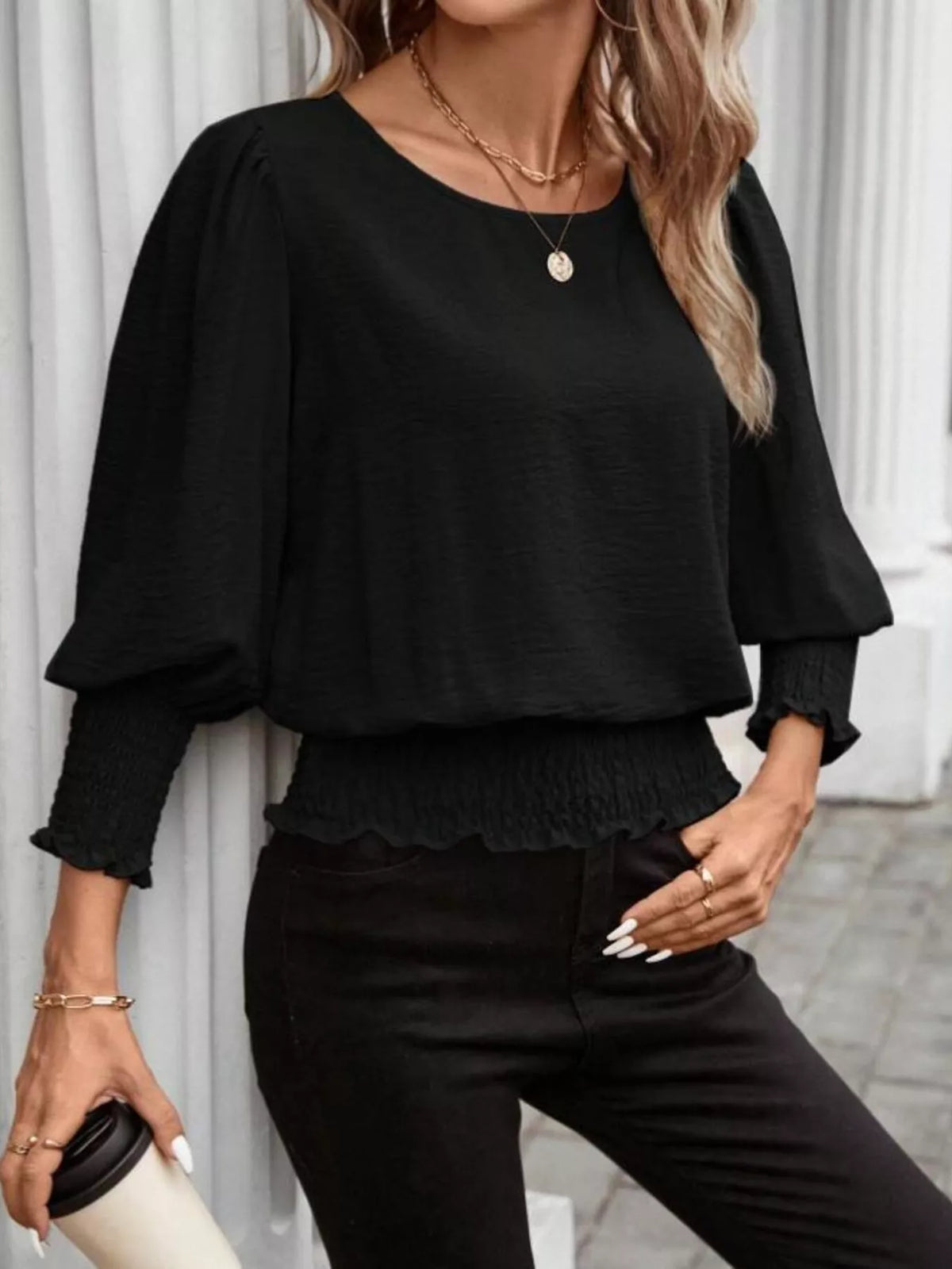 Plush Fashion Hub puff sleeve smocked blouse with ruffled cuffs and floral pattern, stylish and feminine for casual wear.