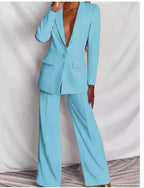 Women's professional blazer and trousers suit set by FitiqueFit, featuring a long sleeve blazer and full-length trousers.