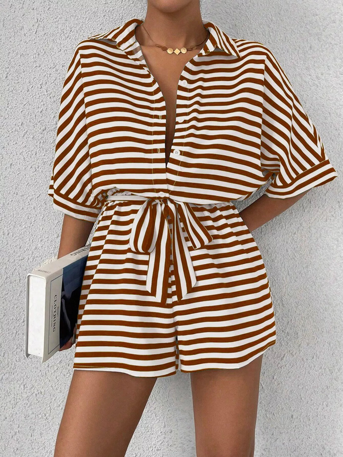 Striped button-front half sleeve romper shirt by Plush Fashion Hub, featuring a casual design with a collar and front buttons.