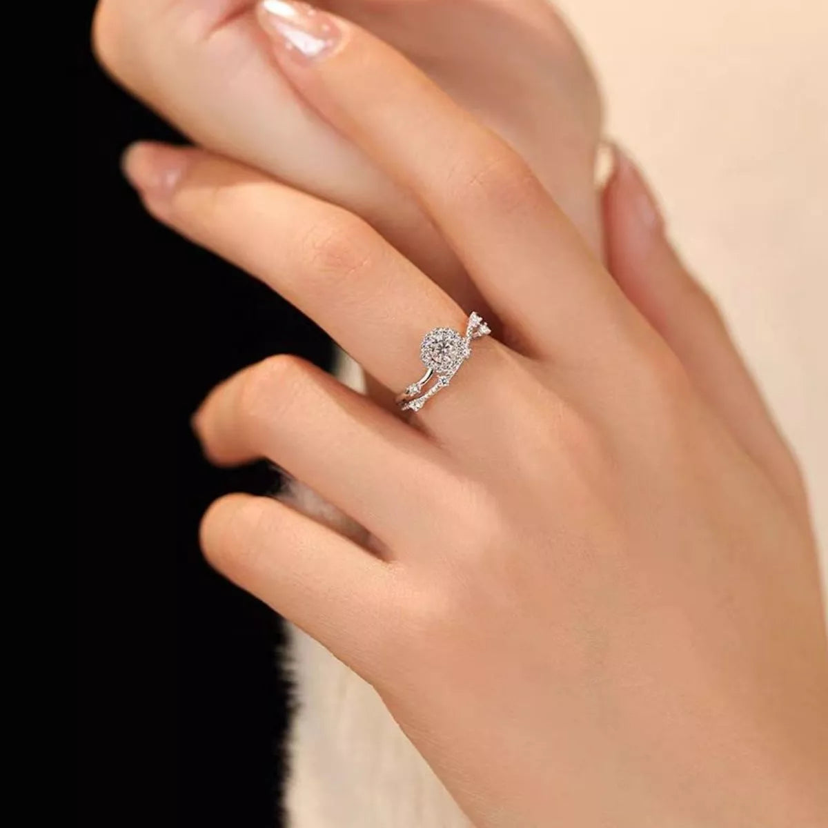 Sterling silver layered ring with 1 carat moissanite gemstone, featuring intricate design and polished finish.