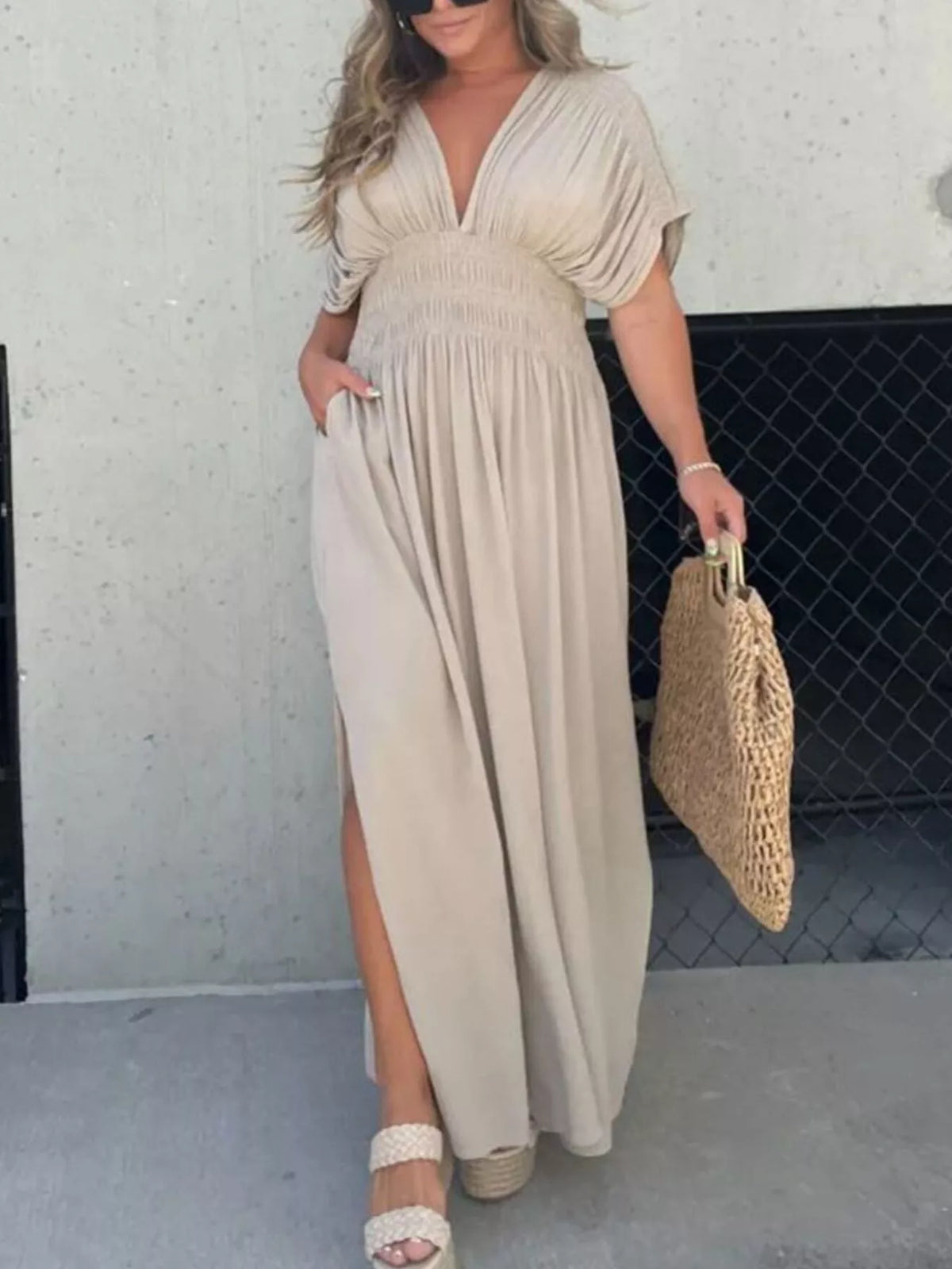 Plus size full slit V-neck maxi dress with smocked waist from Plush Fashion Hub, shown in a flowing fabric with a stylish slit.