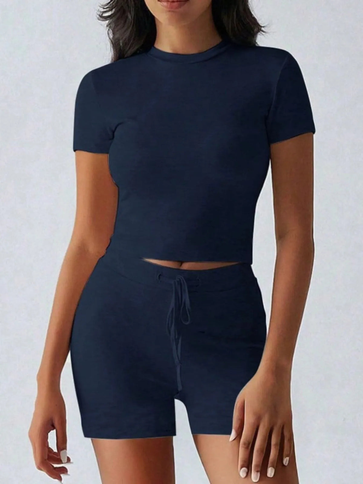 Plush Fashion Hub active wear set with round neck short sleeve top and matching shorts, perfect for workout or casual wear.