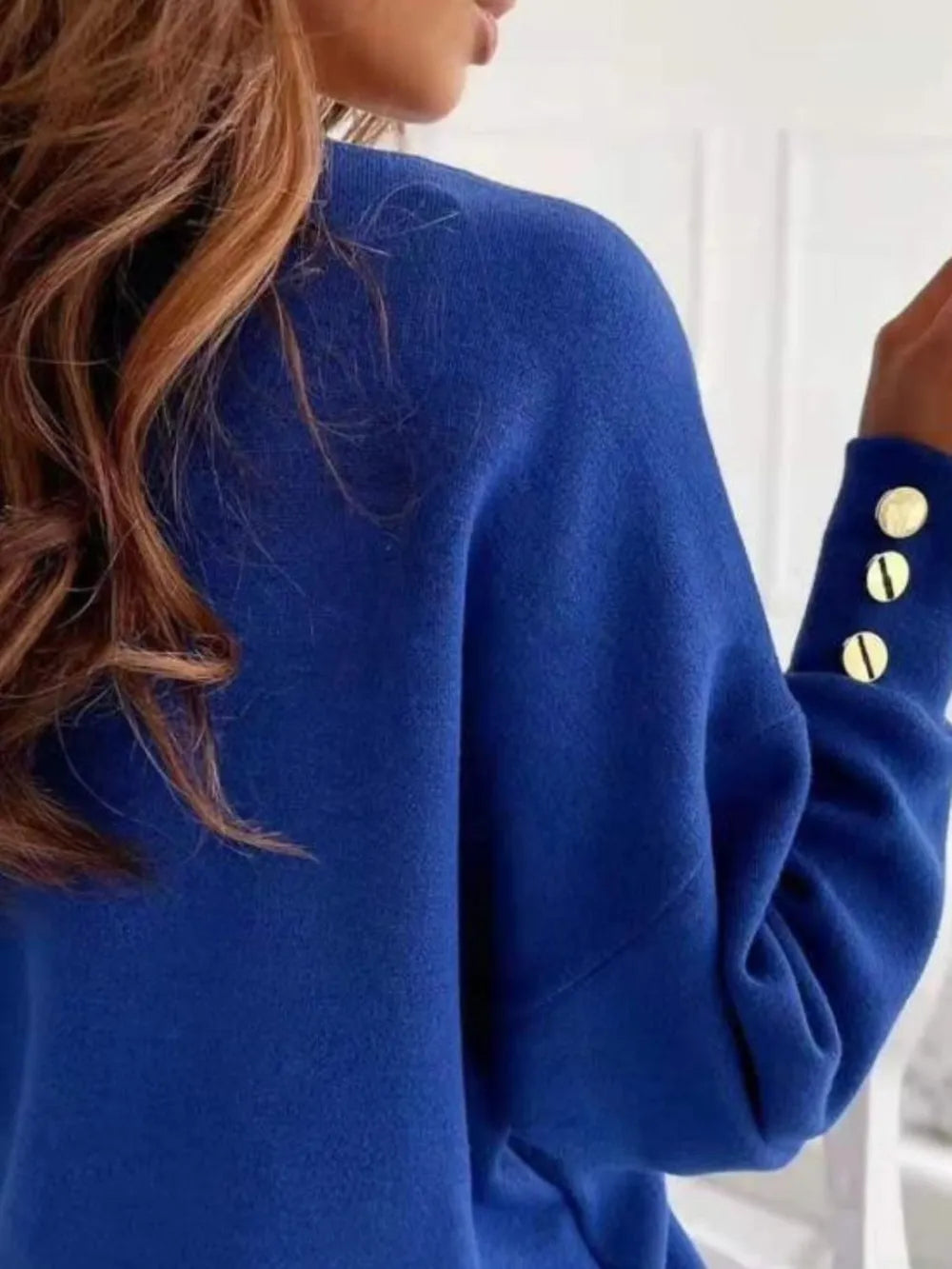 V-neck long sleeve sweatshirt by Trendsi in soft fabric, shown in a neutral color, featuring a relaxed fit and casual style.